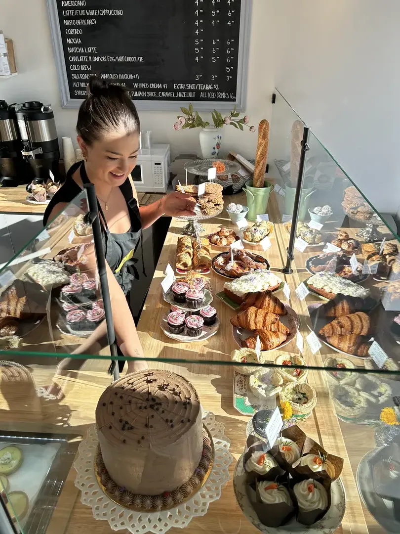 Bakery counter with pastries and cakes.