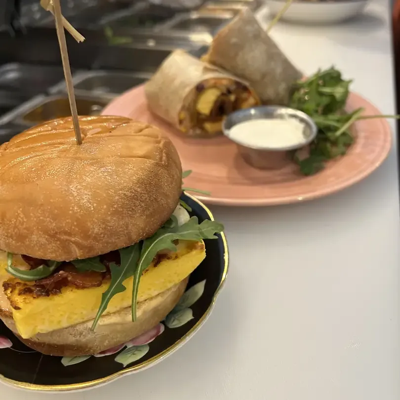 Breakfast sandwich and wrap with sauce.