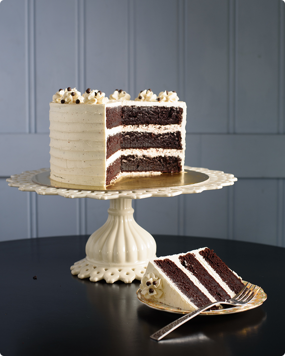 Chocolate layer cake sliced on stand
