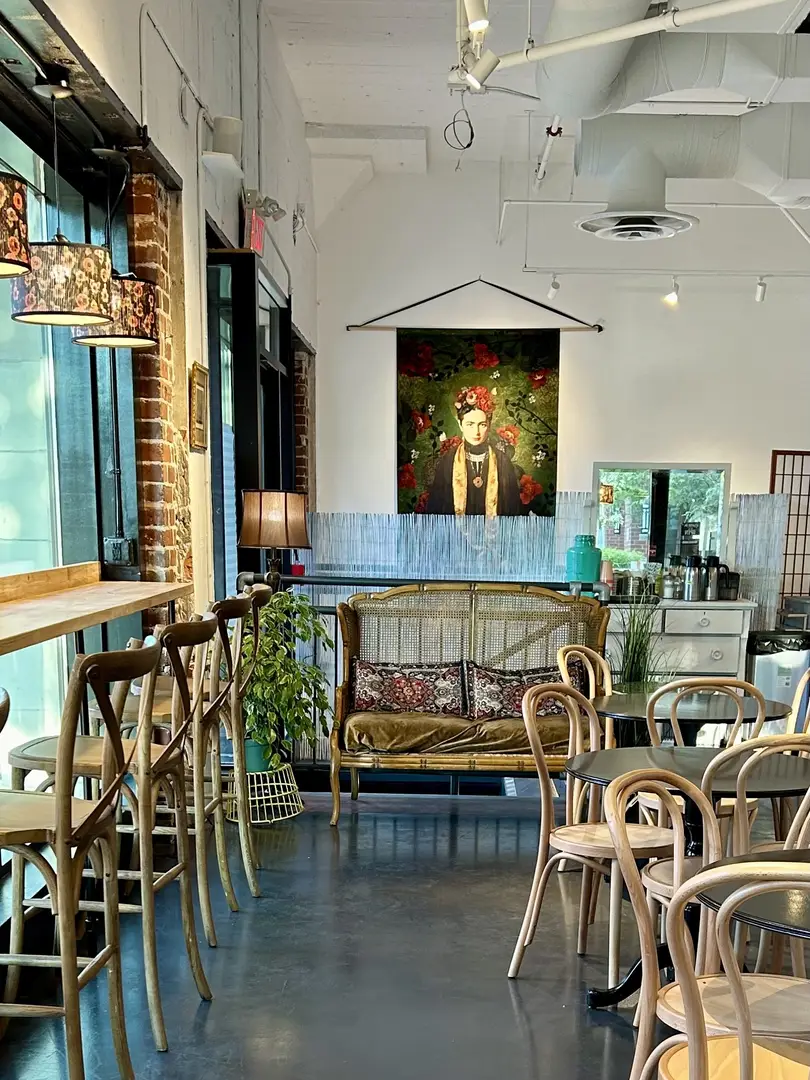Cozy cafe interior decorated with art.
