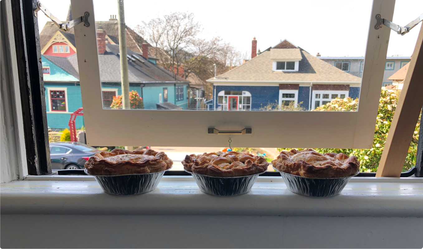 Four pies cooling on windowsill